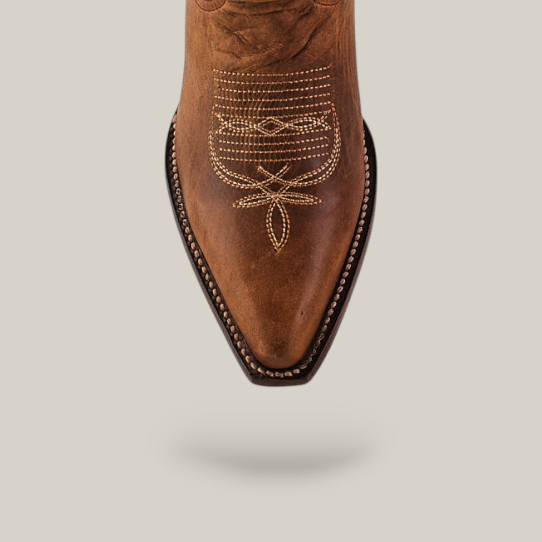 Top view of the Fresno - Tabaco - Snip Toe cowboy boot featuring quality brown leather, decorative white stitching on a pointed toe, and expert craftsmanship, set against a plain light background.