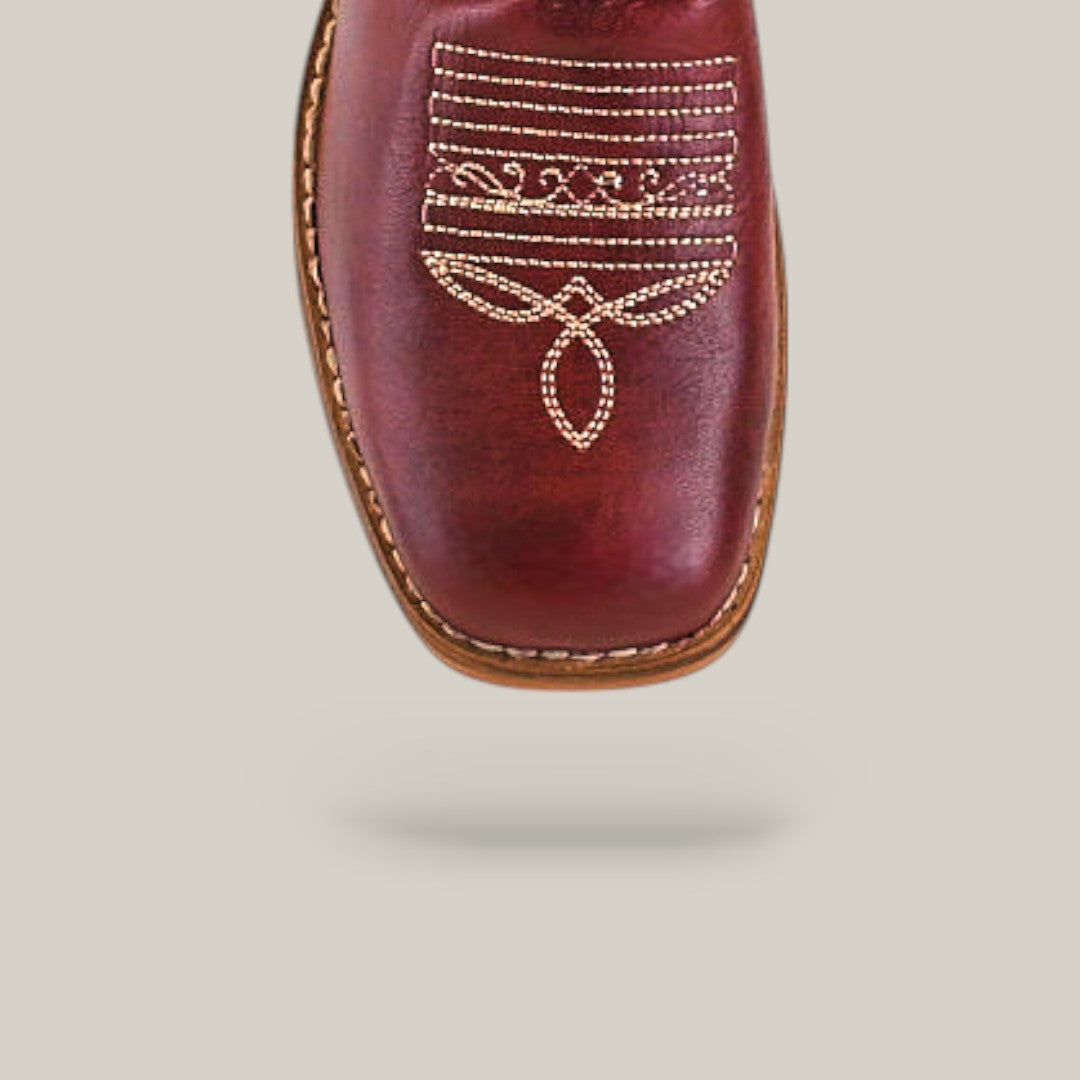 Close-up of the square toe design on Blake Cognac - Square Toe - Kids Boots in brown leather, featuring intricate white decorative stitching, shown against a plain light background.