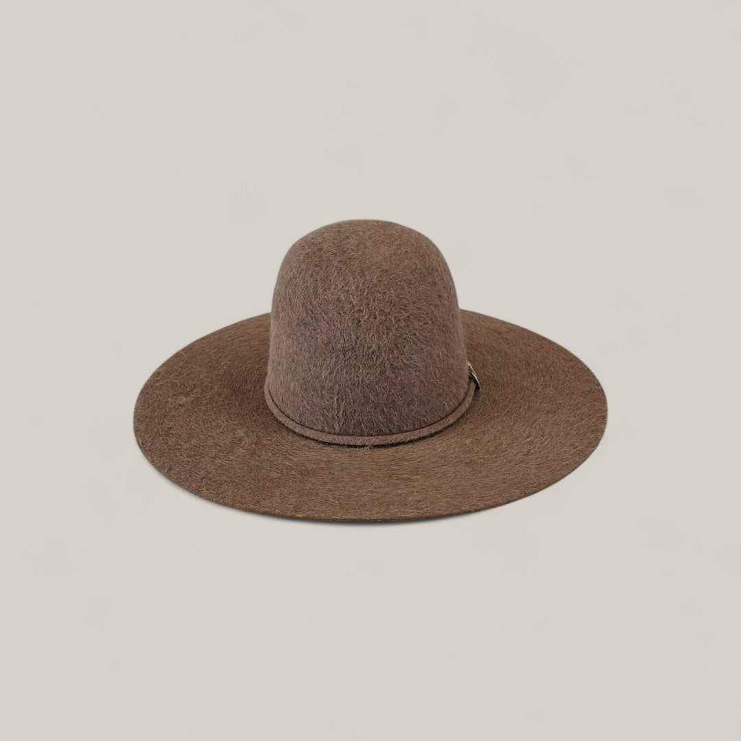The 10X Grizzly - Tacchino, a brown felt hat with a tall, rounded open crown and wide brim, is displayed against a plain light beige background.
