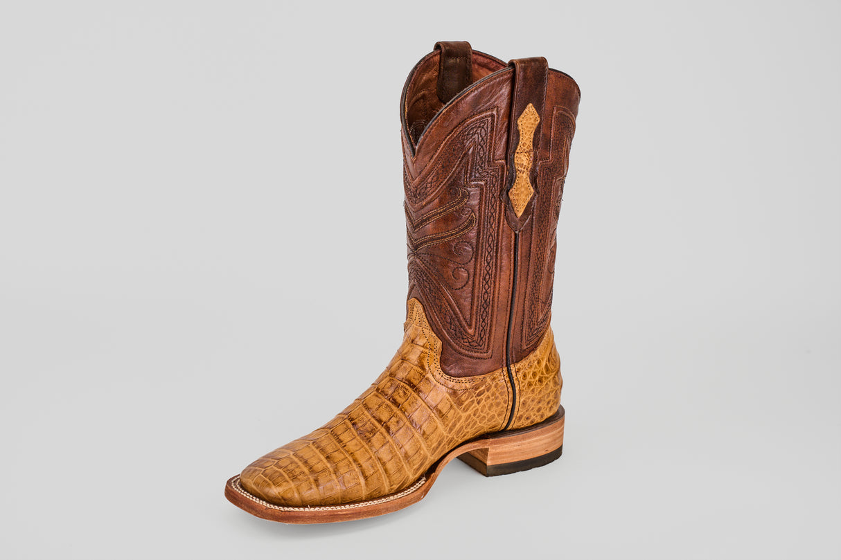 Introducing the Exotic Caiman Belly - Camel - Square Toe: a single cowboy boot with a tan caiman leather lower, brown stitched tall shaft, and classic square toe, displayed on a plain light gray background.