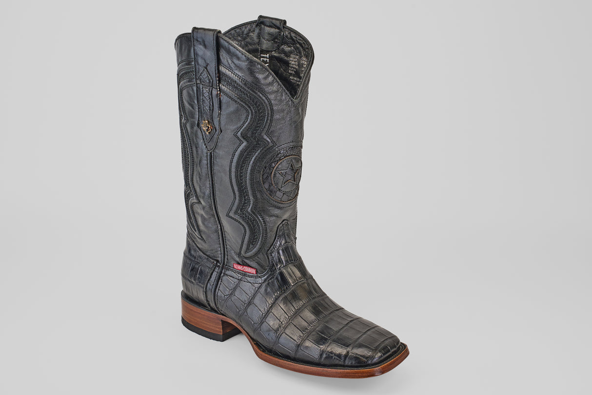 The Exotic Alligator Tail - Black - Square Toe cowboy boot features detailed stitching, a decorative embossed star, and a wooden sole, shown in black with a square toe on a plain white background.
