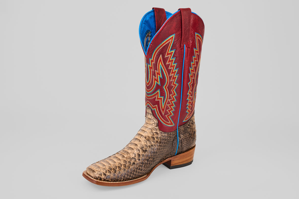 The Barlow - Taupe - Square Toe features a textured taupe python leather foot, wooden heel, tall red leather shaft with colorful stitching, and blue lining—a bold statement boot for men.