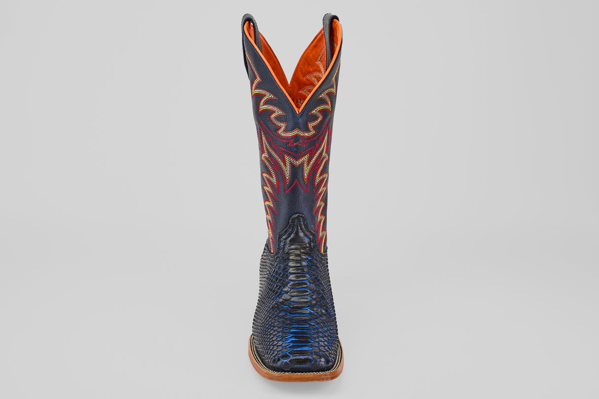 A single navy cowboy boot from the McGraw collection with a square toe, reptile-like texture, and detailed red and yellow stitching on the shaft, displayed upright against a plain light background.