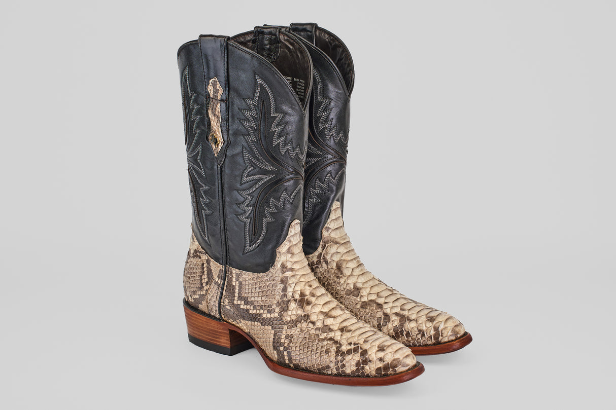 The Tanner - Natural - Roper Toe boots feature black leather uppers with decorative stitching, natural python-patterned lowers, wooden heels, and a subtle sheen—bringing a touch of Tacoma style.