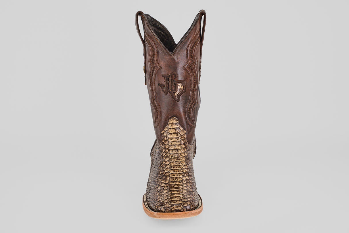 The Tanner – Dune – Square Toe boot features a brown, western-inspired design with a reptile-patterned toe and a stitched Texas outline on the shaft, shown from the front against a plain light background.
