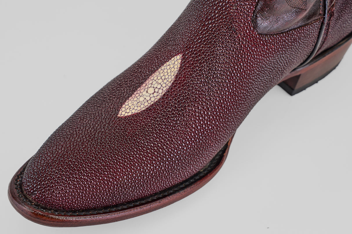 A close-up of the Ranger – Wine – Round Toe boot in burgundy textured leather, featuring a unique oval-shaped lighter patch near the toe, shown against a plain light background.