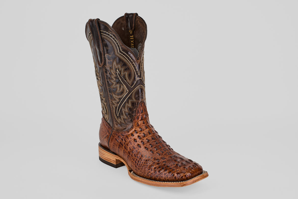 The Hornback Brown - Embossed Leather - Square Toe (E427) boot features textured brown leather, a darker stitched upper shaft, low heel, and square toe, shown on a light gray background.