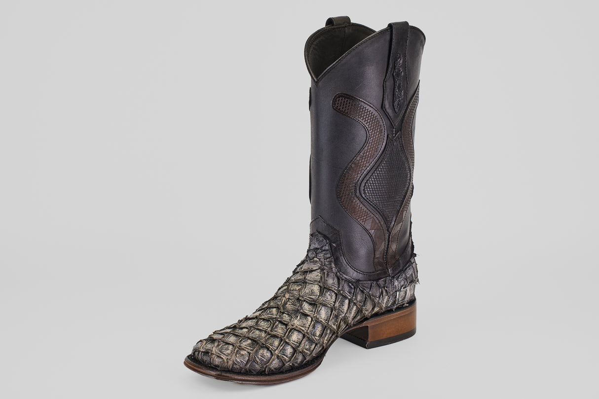 The Conor Platinum - Newspaper - Square Toe (Diamond) cowboy boot features a textured pirarucu-style lower, smooth dark upper with decorative stitching, and stands out as a stylish men’s western boot against a plain white background.