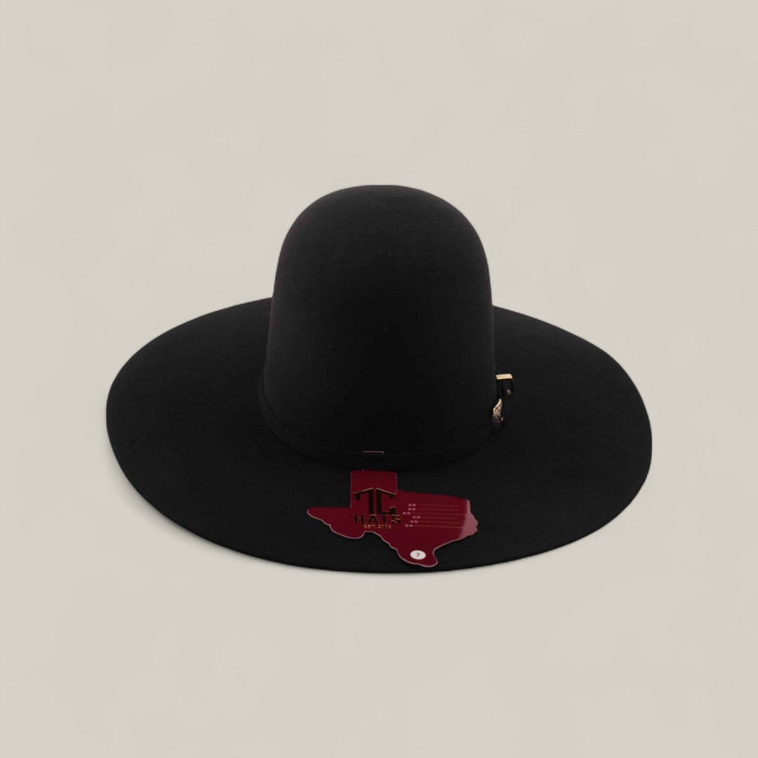 A 4X Black TC Hat with a wide brim features a maroon Texas-shaped patch displaying TLC and the Texas outline on the brim, set against a plain light beige background.