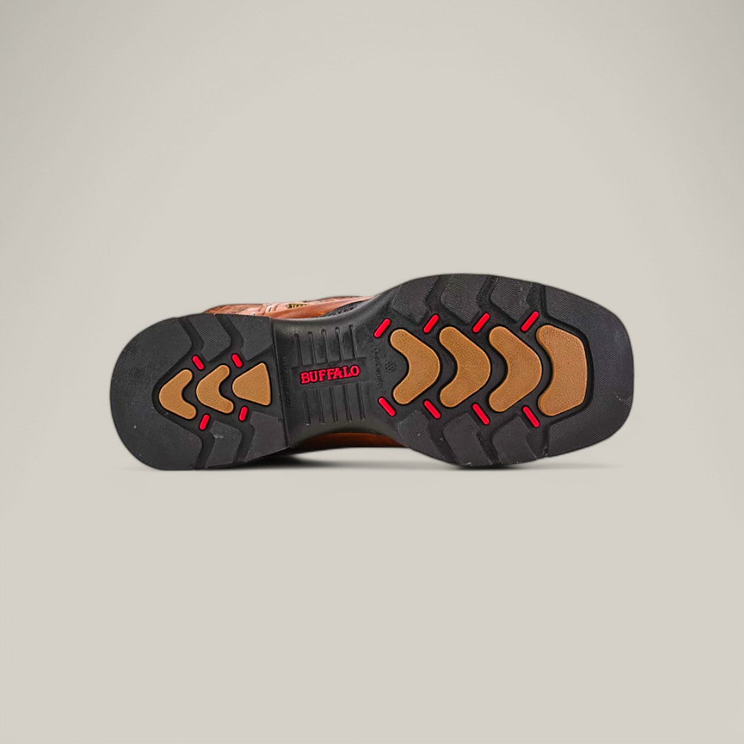 The image displays the sole of the Crater Honey Composite Toe - E6087 shoe with a black and brown rubber design, highlighted by red accents. BUFFALO is featured in red text at the center, echoing Texas Country Work Boots style while focusing on durability across varied terrains.