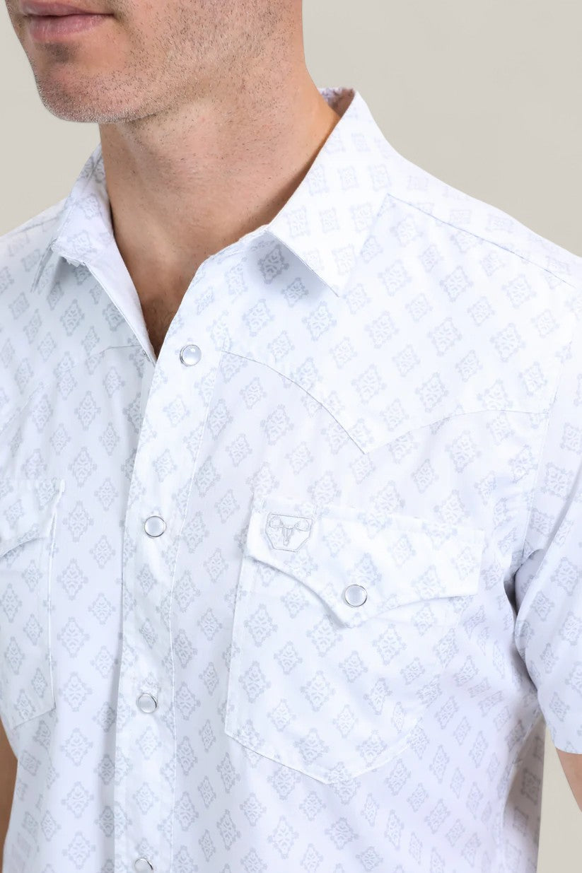 A man wears the Mens Performance Western Short Sleeve Aztec Print White Shirt (PGW10631) with two front pockets and a subtle pattern. His face is partly out of frame in this chest-up shot.