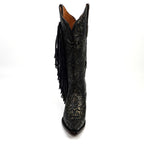Black cowboy boot with intricate designs and fringes on a white background