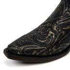 Black cowboy boot with intricate gold embroidery on a white background