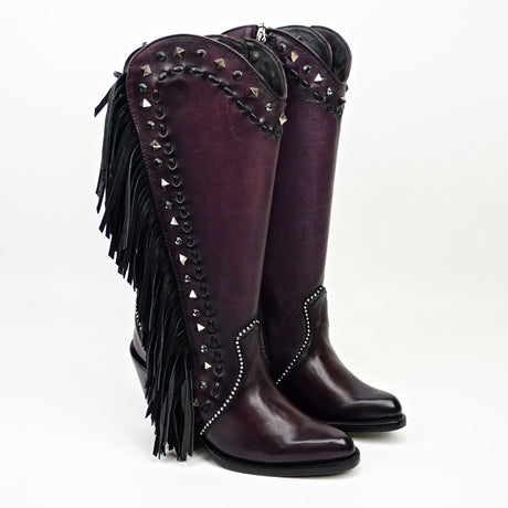 Purple knee-high boots with fringe and studs on a white background
