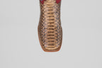 A close-up, top view of the Barlow - Taupe - Square Toe boot highlights its python leather texture, detailed scale patterns, and visible stitching—an eye-catching choice for mens statement footwear.