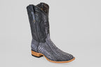 The Austin Leg - Blue Jean - Square Toe is a men’s cowboy boot with a black leather upper and textured gray-black lower, featuring ostrich-style patterning, brown stacked heel and sole, plus decorative stitching on the shaft.
