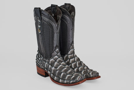 The Conor - Newspaper - Narrow Square Toe boots feature black and silver fish leather with a scale-like lower section, smooth upper shaft, stacked wooden heels, and a narrow square toe.