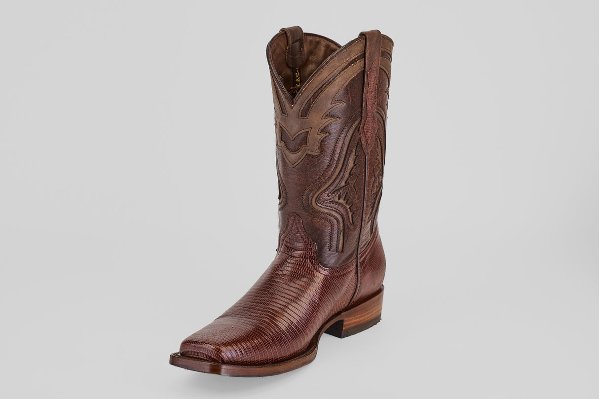 The Blaze – Brown – Rodeo Toe boot features genuine lizard leather, decorative stitching, a pointed square toe, and a low wooden heel, shown against a light gray background.