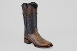 The Tanner Platinum - Dune - Square Toe (Imperial) boot features a textured brown snakeskin foot, black and brown leather shaft with quilted patterns, plus a Texas-shaped emblem—making it a bold, stylish choice among men’s cowboy boots.