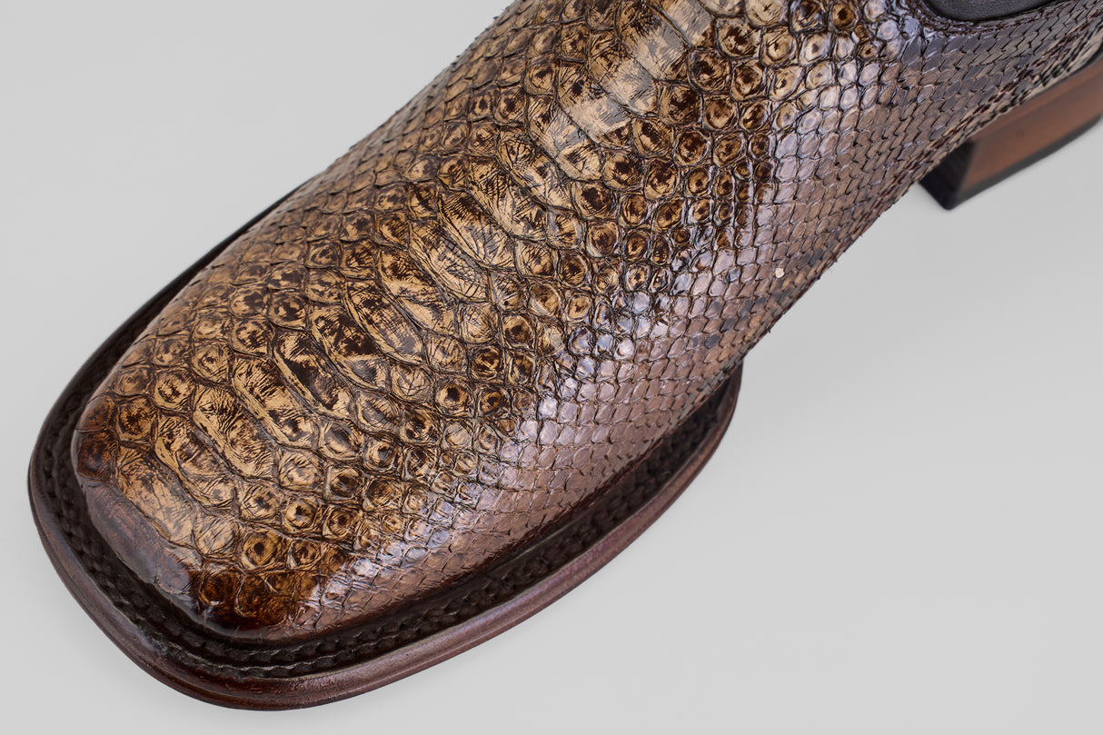 Close-up of the toe of the Tanner Platinum - Dune - Square Toe (Imperial) brown leather dress shoe, showcasing a python-inspired reptile pattern and square toe design against a plain light background.